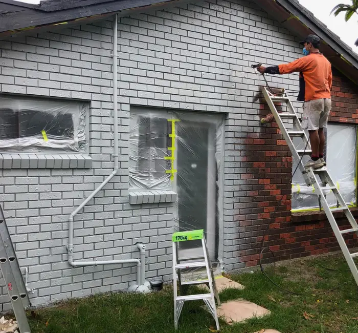 Our painters painting a house in Chelsea
